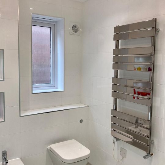 Chrome radiator in bathroom